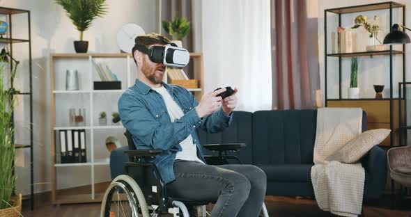 Handicapped Man in Special 3d Glasses Playing Videogame with Gamepad and is Dissatisfied alt