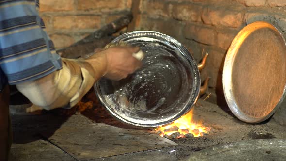 Tinsmith Covering The Copper