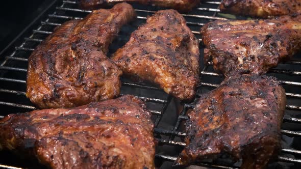 Tasty Ribs Cooking on Barbecue Grill for Summer Outdoor Party alt