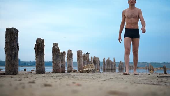Yogi Man Walking On Old Beach