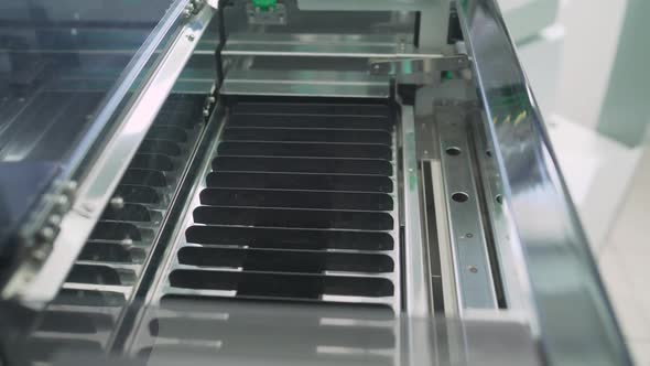 Laboratory Assistant and Test Tubes with Blood alt