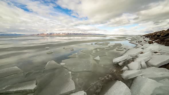 Ice piles at the edge of Utah Lake in winter time-lapse alt