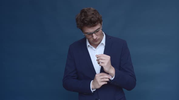Caucasian Male Model Buttoning Up His Suit alt