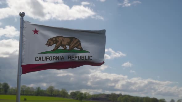 California Flag on a Flagpole Waving in the Wind in the Sky alt
