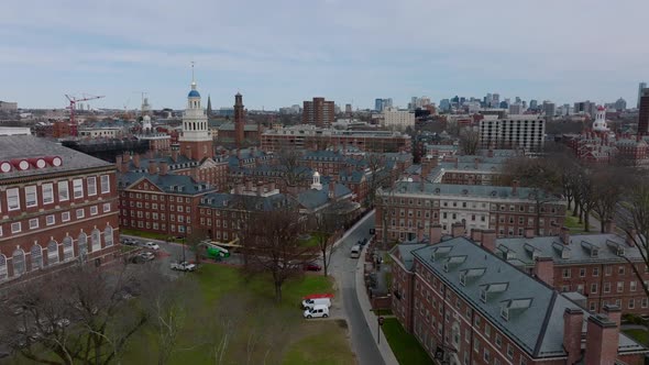 Forwards Fly Above Buildings with Red Brick Style Facades alt