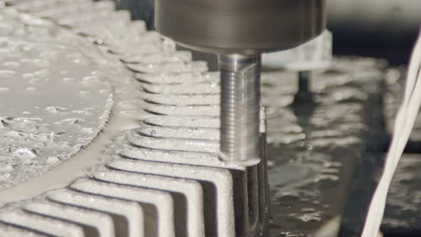 Machining process - CNC mill manufacturing an advanced metal part alt