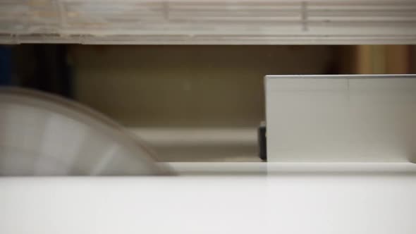 Close Up of Machine Cutting Wood Precisely with a Circular Saw alt