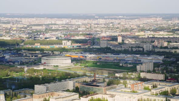 A View From a Helicopter Flying Over an Urban Area with a Round Large Stadium of the Skk in St