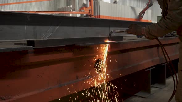 Manual Metal Cutting, Spark Flow and Flame Torch on Dark Background. Industrial Production alt