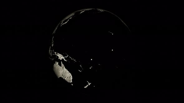 Black and White Planet Earth Rotates on Its Axis on Black Background