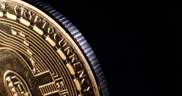 Looping macro shot of a valuable and secure digital cryptocurrency bitcoin at an encrypted financial alt
