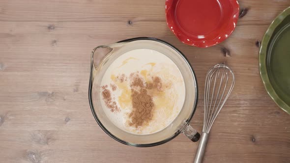 Step by step. Mixing ingredients for pumpkin pie filling. alt