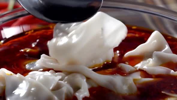 Chinese dumplings in red chili oil