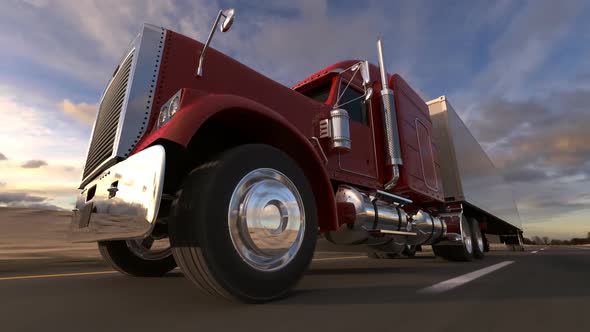 Huge semi-trailer cargo truck riding on the highway. Wheel closeup. Loopable. HD alt