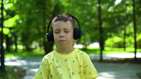 Boy listening to music with headphones alt