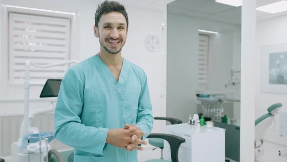 Young Medical Doctor Man Presenting and Showing Copy Space for Product or Text. Caucasian Male alt