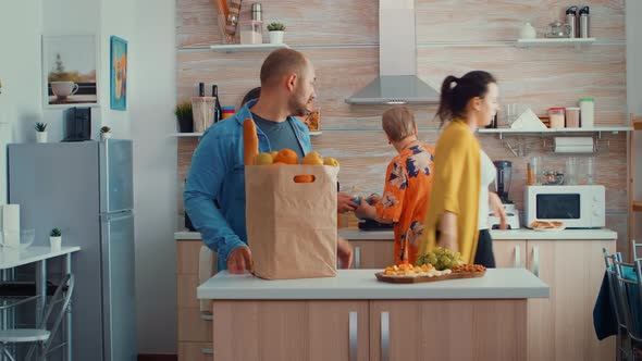Young Couple Coming From Shopping alt