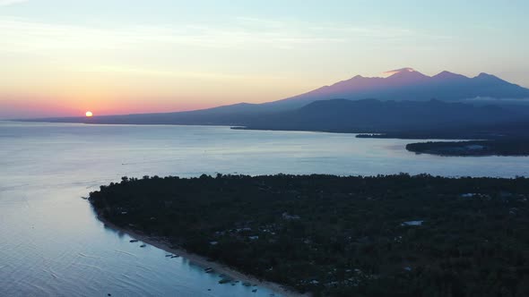 Aerial , the Gili Islands off the coast of Lombok, Indonesia, at sunset. The Gilis are the most popu alt
