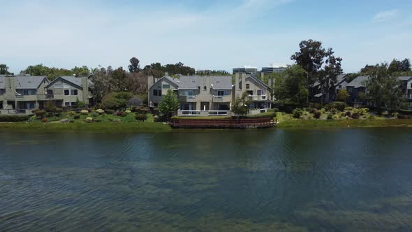 Pull Back Shot From Remarkable House Cottages Built On Quite Lagoon Of San Mateo, California alt