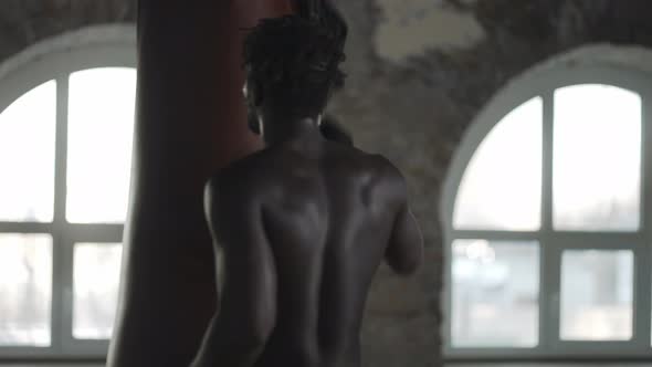 African American Boxer Wipes Sweat on Face After Hard Training alt