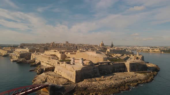 Breathtaking aerial view of Fort St Elmo and Valetta city in the morning light of a beautiful summer alt