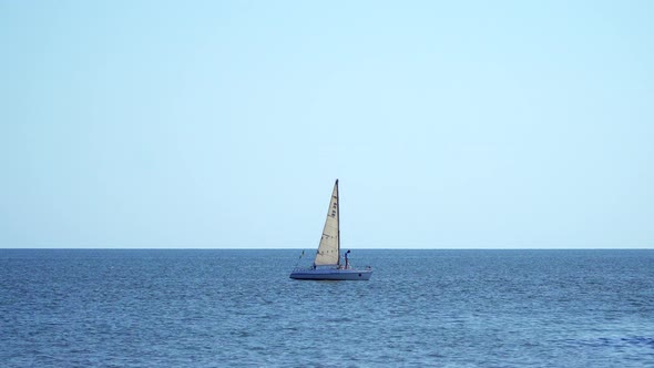 The Yacht With Sails Floating On the Sea