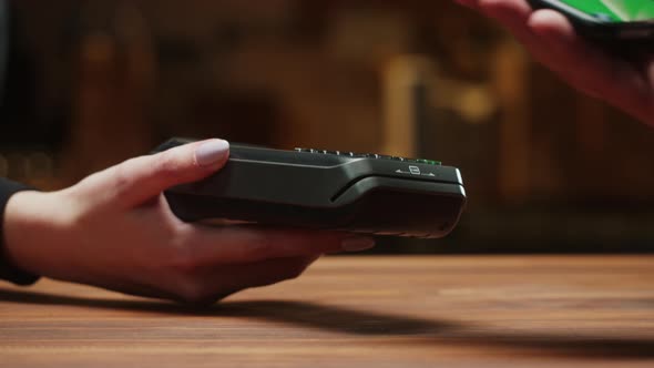 Paying By Smartphone with Chroma Green Screen Closeup alt