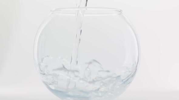 Clean Crystalline Beaty Water Flows and a Strawberry Falls in a Round Bowl alt