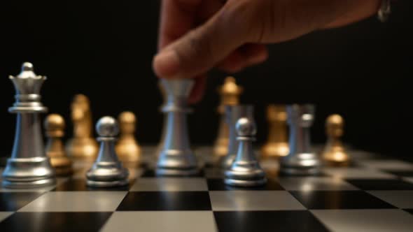 The motion of chess board game, Strategy Games Concept alt