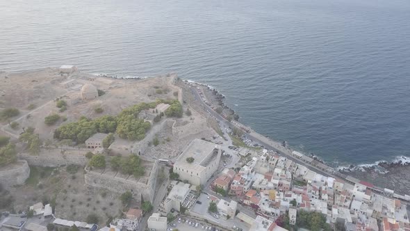 Aerial view of Rethymno cityscape, castle on hill near sea Fortezza old fortress island Crete Greece