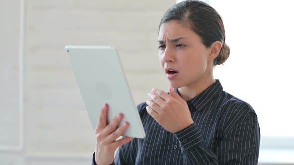 Young Indian Woman Having Loss on Tablet alt