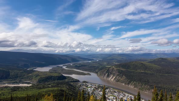 Time Lapse. View of Dawson City From Above on a Cloudy and Sunny Day alt