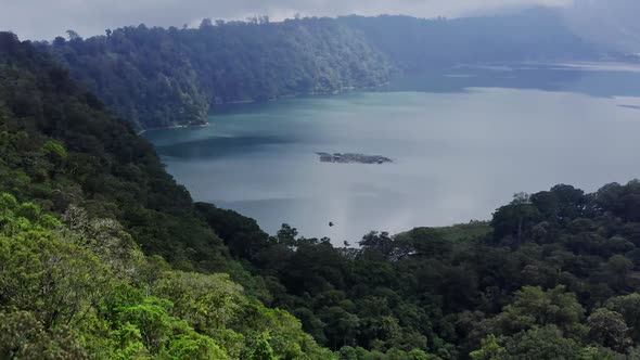 Aerial Landscape Green Mountain And Tropical Trees On Lake Shore. Bali, Indonesia. alt