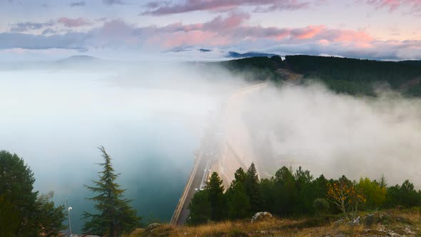Morning Fog over Dam in Aguilar de Campoo, Spain. alt