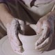 The Potter&#39;s Male Hands Shape and Sculpt the Soft White Clay Pot Spinning on a Potter&#39;s Wheel in a - VideoHive Item for Sale
