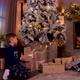 Boys checking presents under Christmas tree - VideoHive Item for Sale
