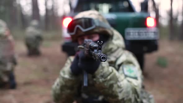 Soldier Prepares To Shoot a Machine Gun