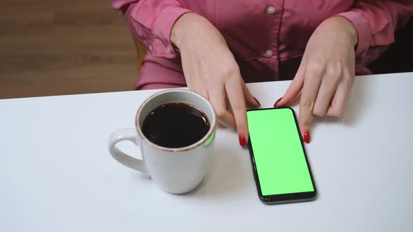 Close Up Woman Hands Using Phone Green Screen Chromakey Woman Drinking Coffee at Home alt