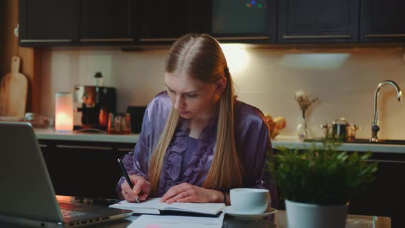 Young Business Woman Working at Home By Sitting at the Computer alt