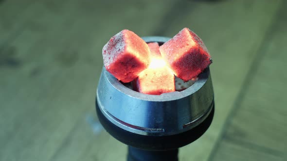 Close up of red hot coals alt