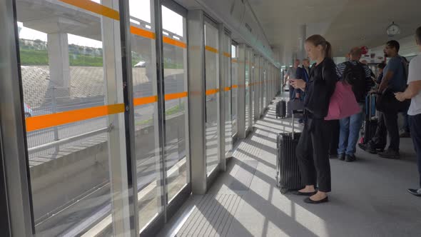 People at train station of Charles de Gaulle Airport in Paris, France alt