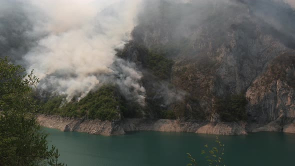 Wild Fire Over Mountain Forest Near Lake Piva in Montenegro in August of 2021 alt