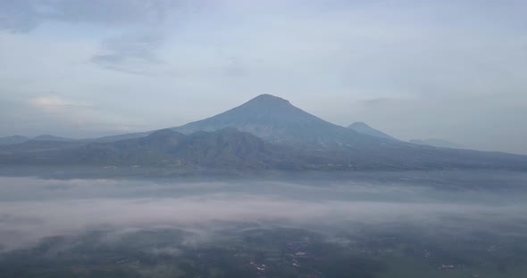 rural view and Mount Sumbing, central java, Indonesia. foggy weather in morning with a view of the m alt
