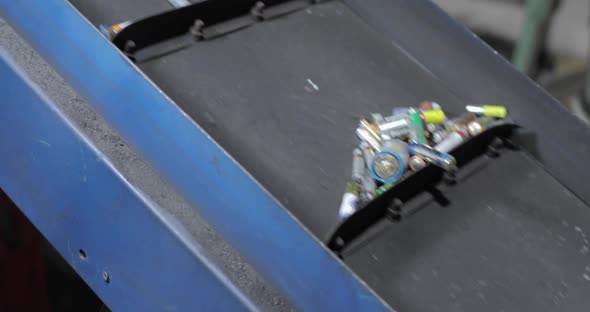 View of a Moving Conveyor Belt with Batteries on It