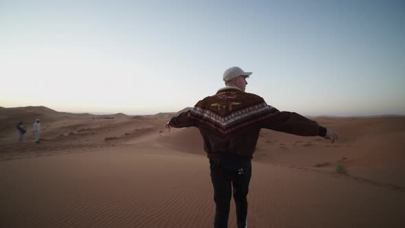 Adult Caucasian Man Enjoying Morning in Desert alt