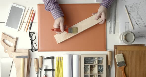 Creative carpenter and designer working at desk