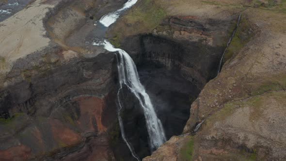 Aerial View of Haifoss Waterfall Crashing Against the Rocks in Iceland alt
