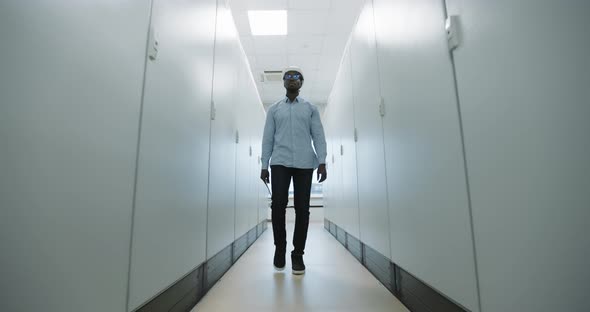 Portrait of an Engineer in a Hard Hat Holding a Tablet alt