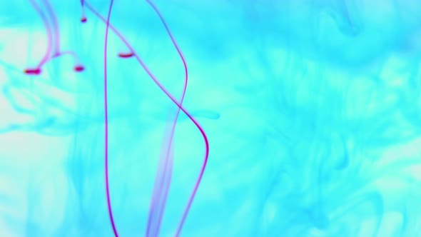 Vivid Color Paint Ink Drops in Water Slow Motion Video White Background alt