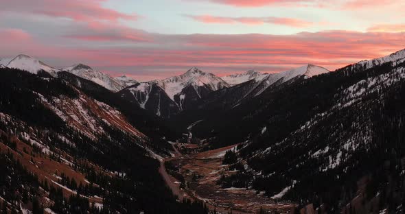 Sunset in Rocky Mountains along Million Dollar Highway in Colorado. Droneing in. alt